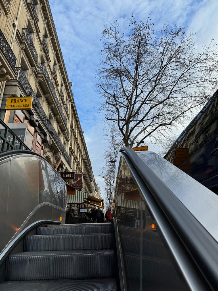 Taking the escalator up to the street
