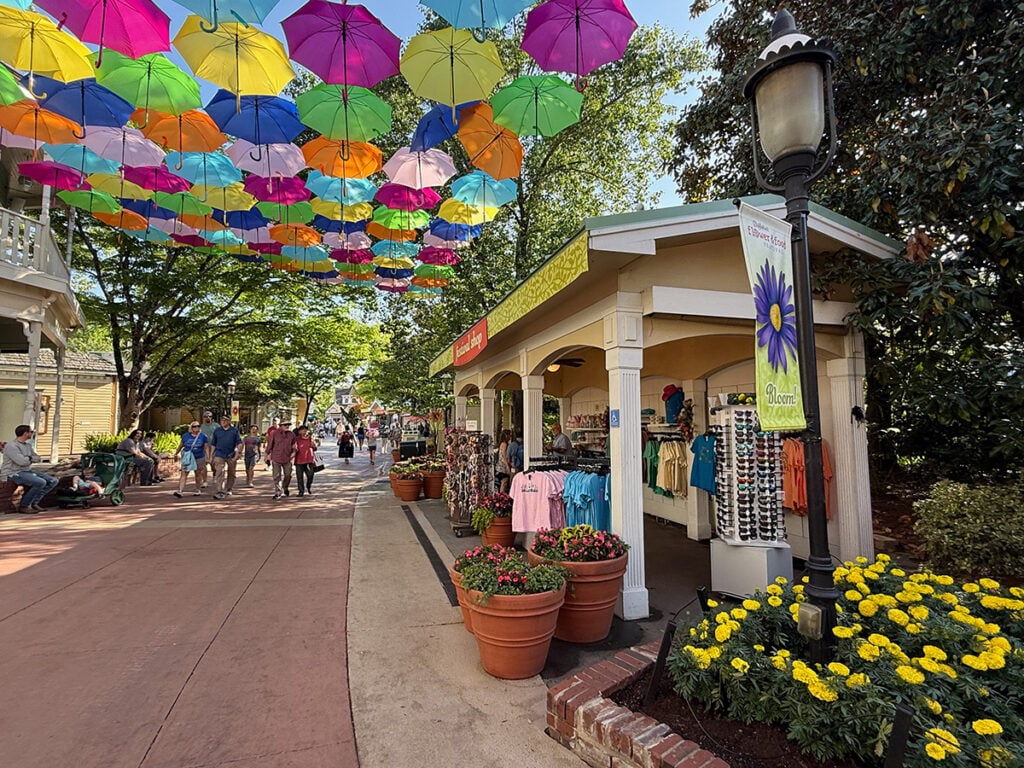 Walkingt through Dollywood under colorful umbrellas