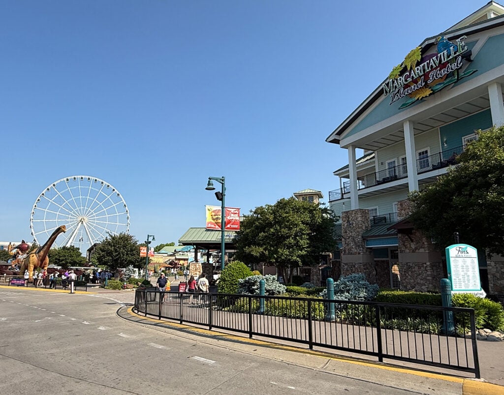 Margaritaville Island Hotel with the Great Smoky Mountain Wheel and one of the many dinosaurs