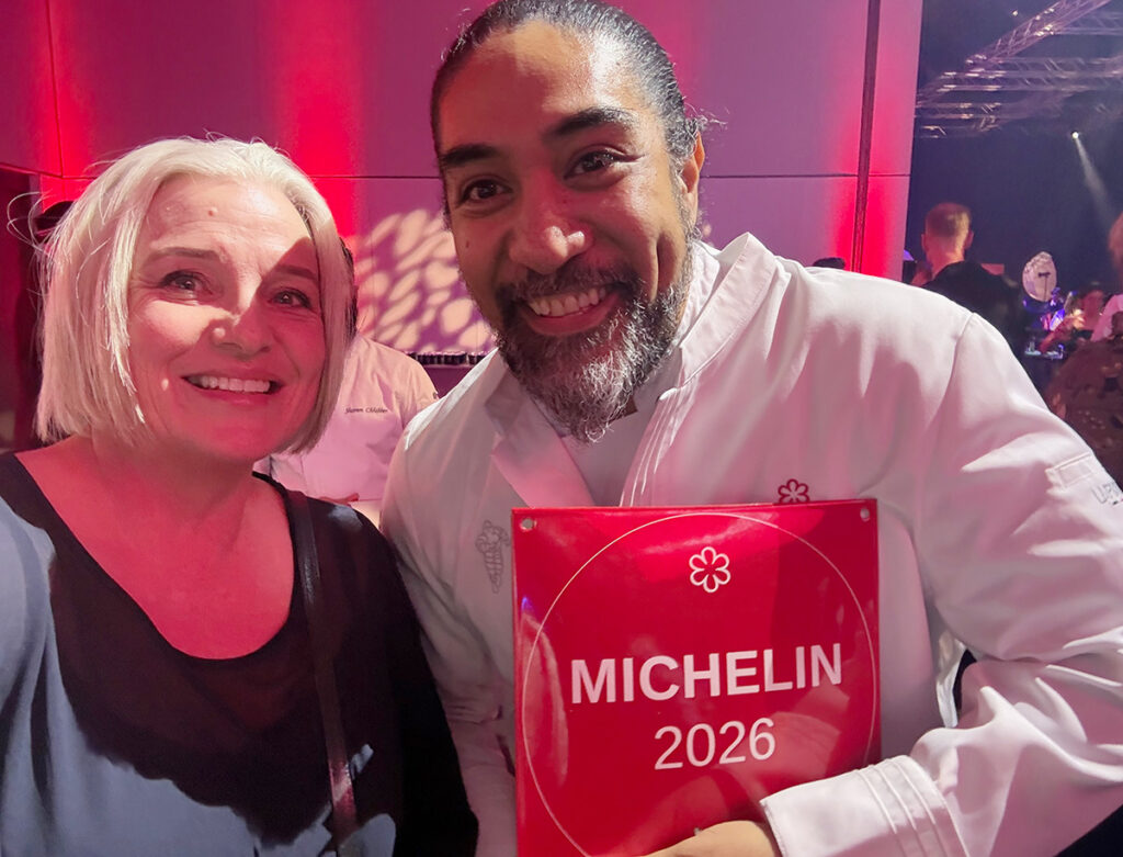 Megan with chef Henry Onesemo of Tala, holding his Michelin star award