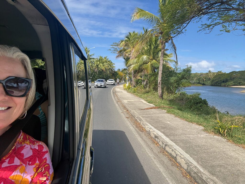 Megan looking out car window driving back from Sigatoka