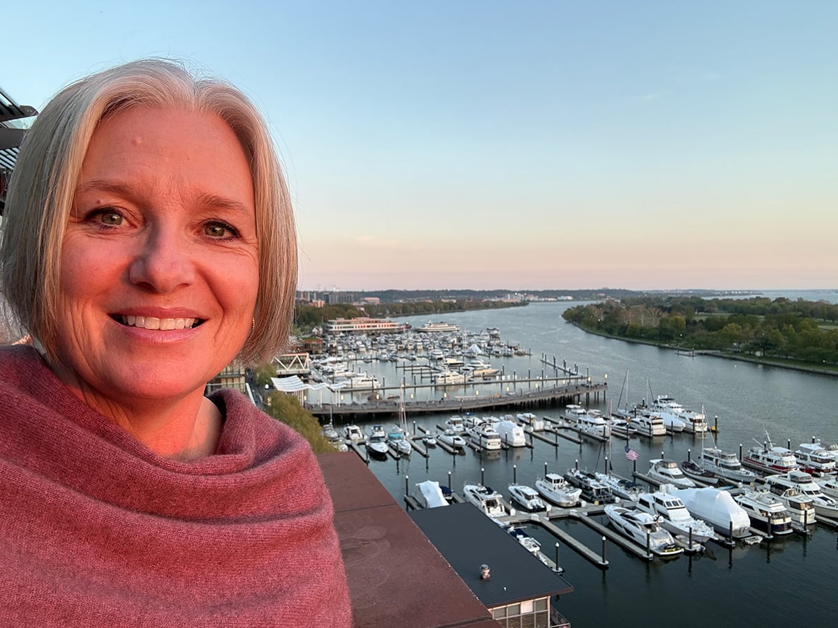 Megan on a rooftop at The Wharf at sunset
