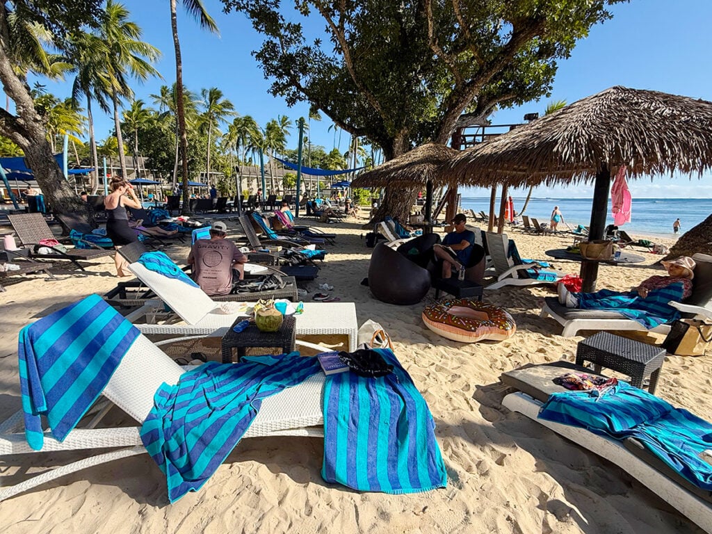 Our beach spot with sun loungers draped in resort towels