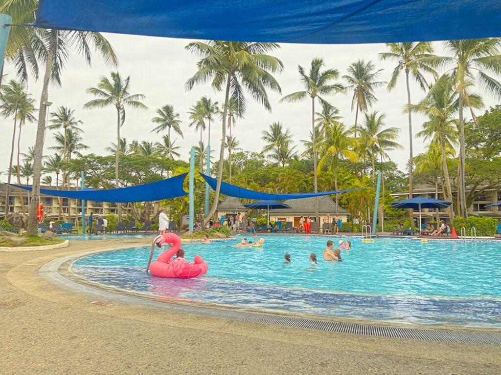 Shangri La pool with pink flamingo inflatable