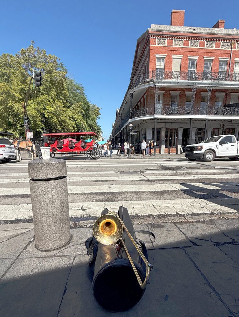Trombone on the ground outside Cafe du Monde, with the musicians on a break