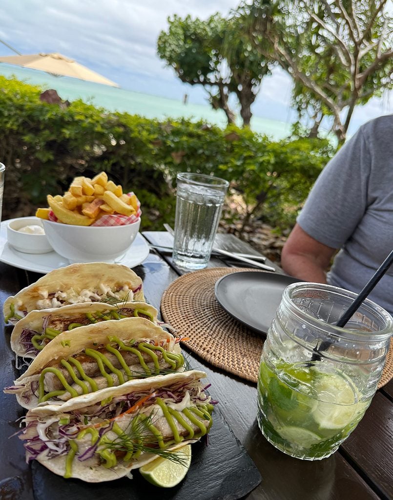 Fresh fish tacos and fries, washed down with a mojito at Pacific Resort