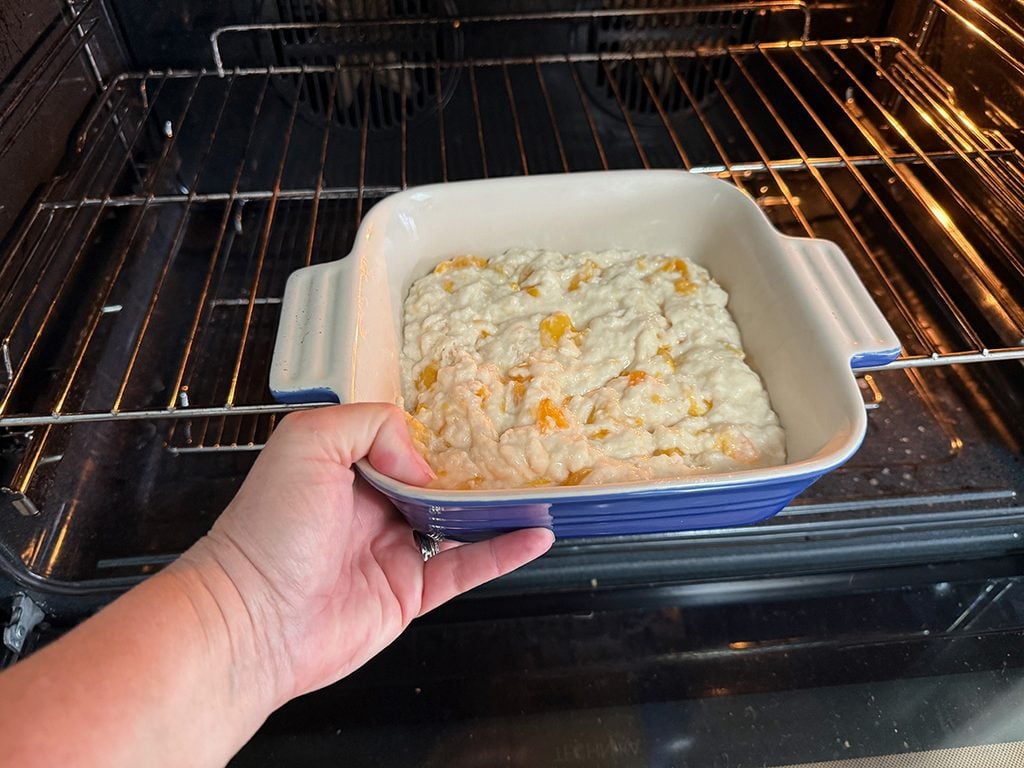 Putting cake into oven