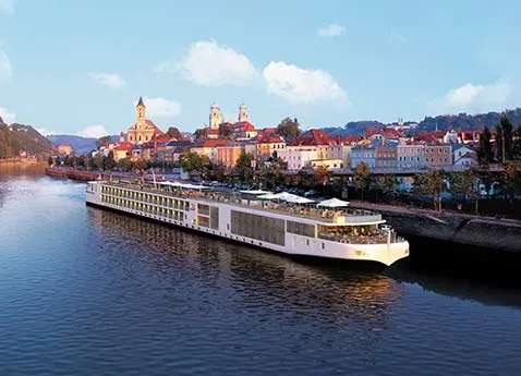A ship from Viking River Cruise docked in a port.